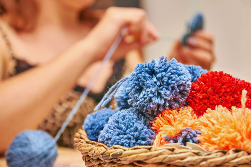 Help your child make a fluffy pom-pom
