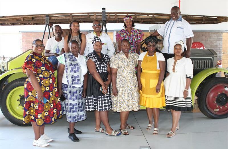 Posing behind an old fire tanker, they honoured both their personal heritage and the rich history of the fire department.