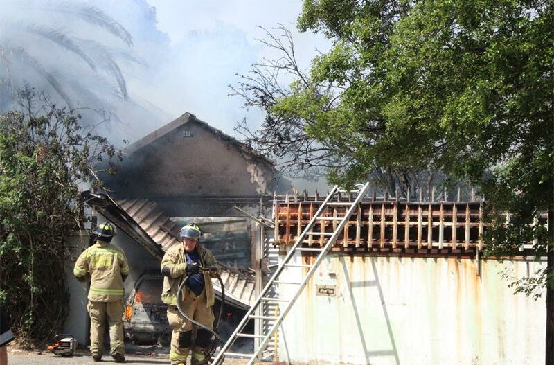 Two men escaped unharmed when a fire engulfed a garage and a vehicle in Primrose.
