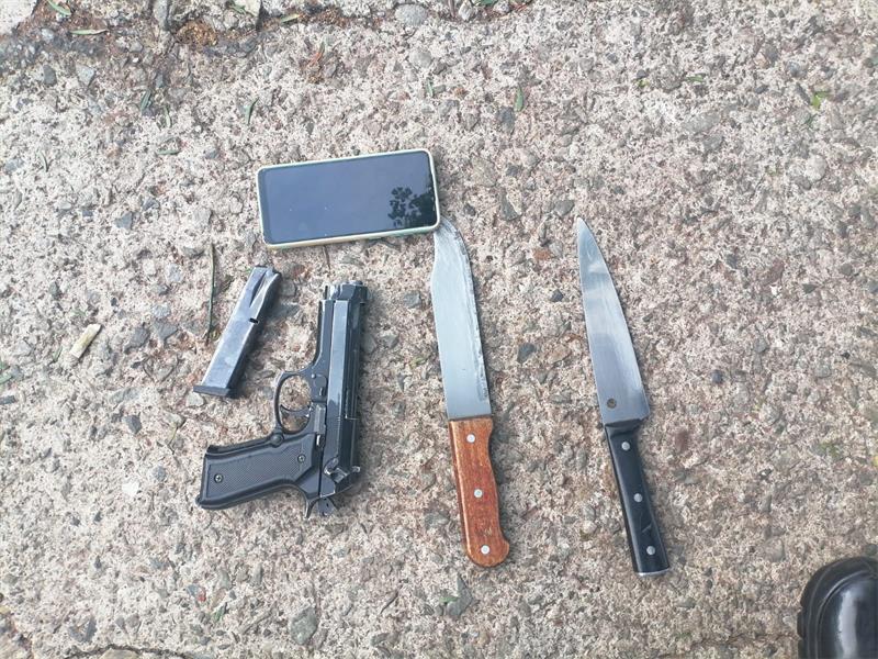 Three men were caught with a gun, knives, and suspected stolen cellphones during a police operation on Cyndonia Road.