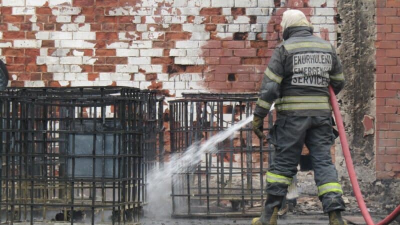 Motorists and residents are urged to avoid Power Road and Railway Street as investigations continue into an early-morning factory fire that sent burning diesel through the stormwater network.