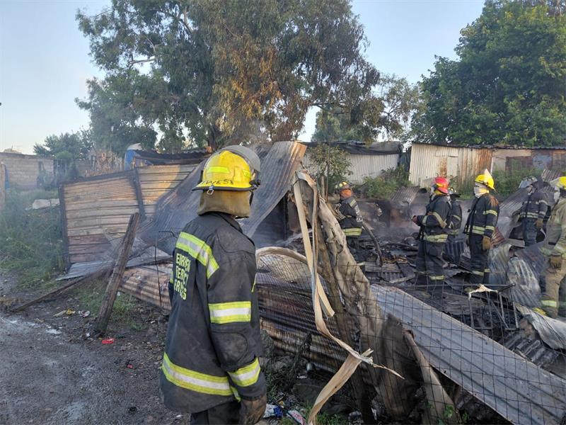 Two people died after a fire engulfed several shacks at the Marathon informal settlement on January 10, with authorities investigating the cause.