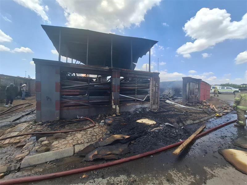 Firefighters successfully contained a warehouse blaze at an informal settlement, preventing it from spreading to nearby shacks, as Ekurhuleni emergency services renewed calls for fire safety awareness following the Summer Safety Campaign.