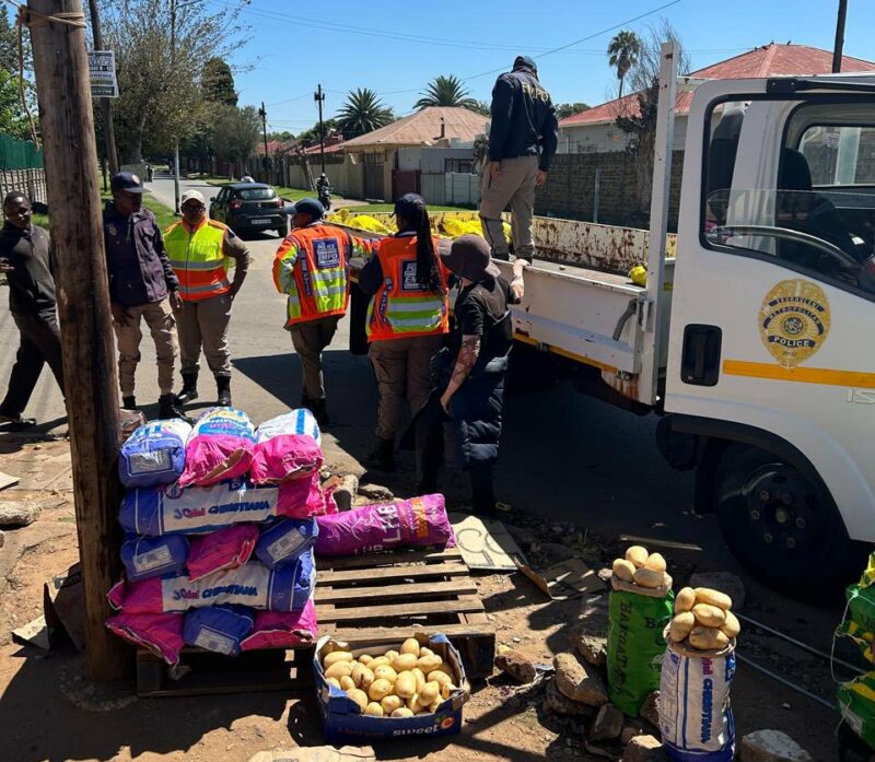 The Ekurhuleni Metropolitan Police Department (EMPD) confiscates goods from unregistered roadside traders during a by-law compliance operation aimed at enforcing valid trading permits in Primrose.