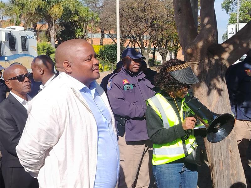 Residents from Leondale, Roodekop Ext 31 and Buhle Park gathered outside the Germiston council chamber during an extraordinary council meeting, demanding urgent intervention over persistent power outages affecting their communities.