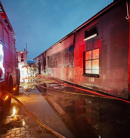 DEMS firefighters prevent major damage as Wadeville warehouse fire erupts.
