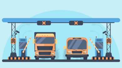 Toll higway. Toll gate construction. Arch for automatic charging on a toll road. Bus and lorry truck on roadway.