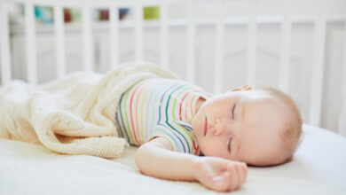 How to get your baby to sleep in their cot