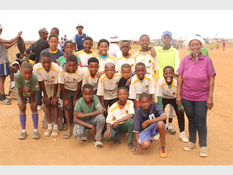 Tsakani's young footballers show skill and determination in high-energy match at Malandela ground.