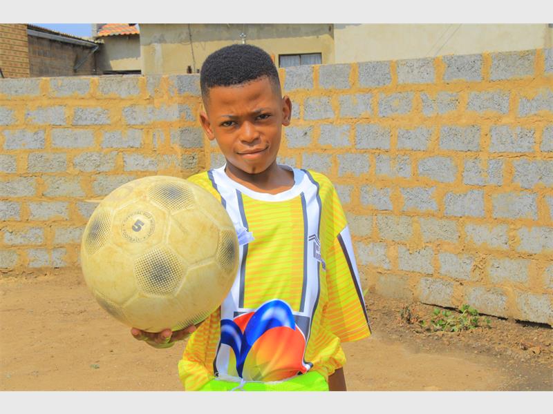 Itumeleng Maseko, a talented 14-year-old striker for Tjovitjo Sporting Club, balances school and soccer while dreaming of becoming a pilot and making his mark beyond the township.