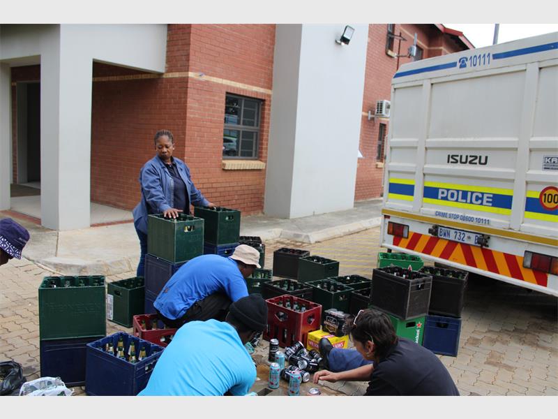 Confiscated alcohol from illegal shebeens was poured away as part of a united push to curb illicit trading.
