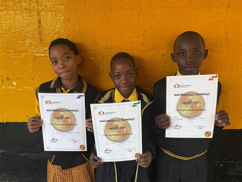 Nosipho, Praise, and Kamohelo shine in local maths competition, advancing to the District level.