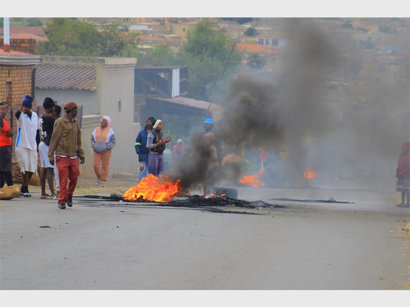 Frustrated residents barricaded streets with burning tyres and stones, demanding answers over prolonged load reduction and lack of leadership response.