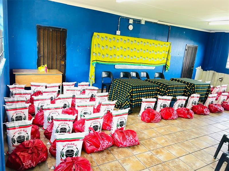 Zonal leadership distributes 50 food parcels and calls on youth to unite against poverty and hunger.