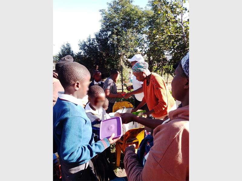 Local organisation continues feeding and mentoring programme, with community support driving its success.