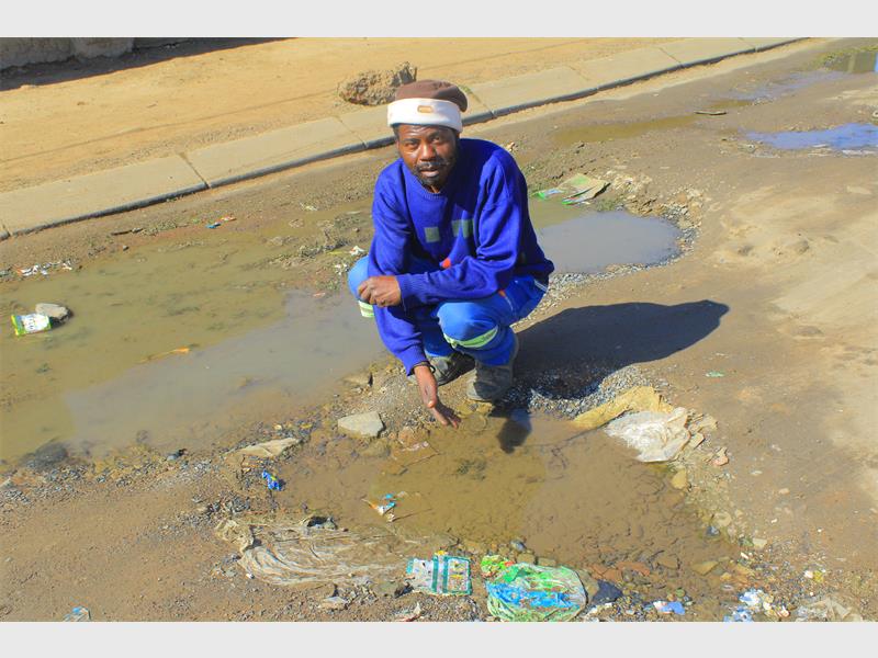 Skhumbane Street residents say an incomplete road project and blocked storm drain have left them battling potholes, stagnant water and foul odours for years.