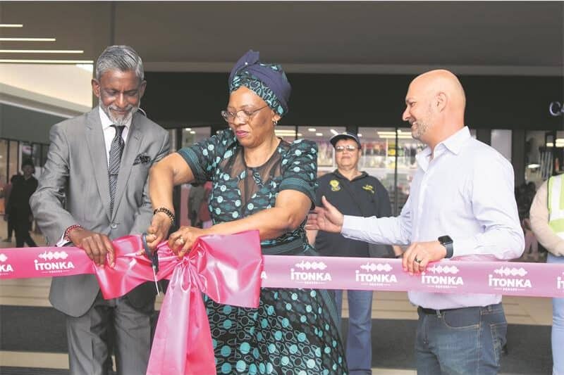 Official ribbon cutting event at African Reporter with dignitaries.