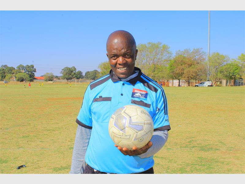 Long-serving official shares his journey from street games to league commissioner while urging young people to take up the whistle.
