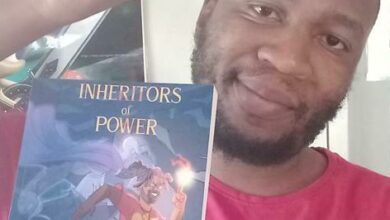 Self-published author Caleb Gumbo with his newly published book, Inheritors of Power.