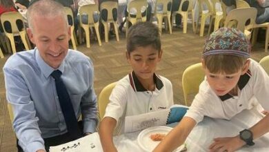 Ryan Haigh, Daniel Golovey and Luciano Neves try different kinds of food.