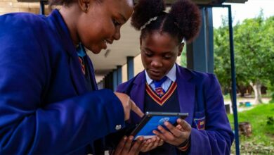 Lulama Mabunda and Ntsako Molele take a closer look at the new e-learning device,