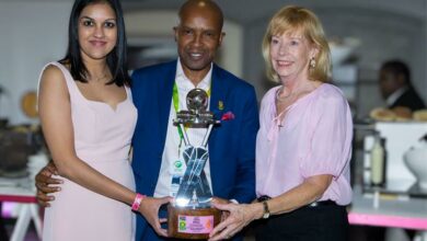 Esha Mansingh, Pholetsi Moseki and Anne Villas receive the host union trophy.