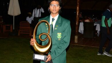 Amilkar Bhana shows off his trophy.