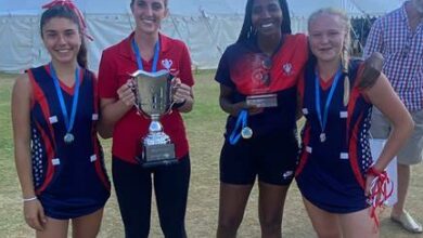 Daniella Thomas, Ashleigh Gray, Tshepiso Maponyane, and Sophie Shelly after collecting their medals and troph