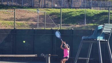 Aarya Sunker hits the tennis ball with a racket.