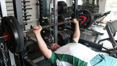 Craig Masson lifts weights.