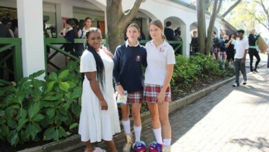Odwa Ramapulana, Lisa Amm, and Julia Bregman show off their slippers.