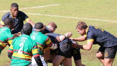 Springs High School tackle each other during the game