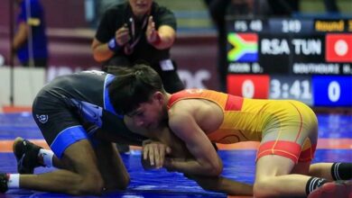 Haroun Bouthouri of Tunisia and Dominick Aoun wrestle in the freestyle final.