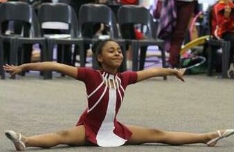 Isabella Govender does a side split during the competition.
