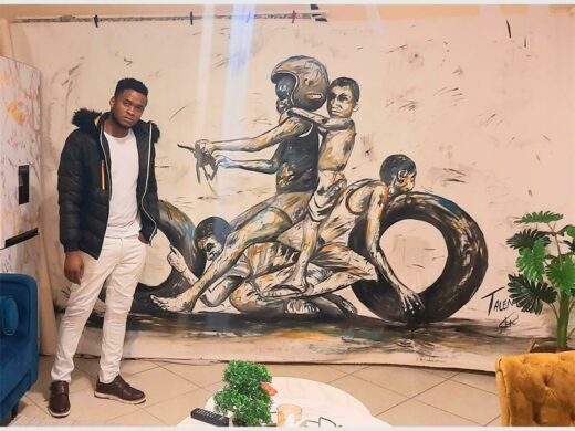 Tallent Ncube next to his painting.