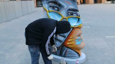 Graffiti artist Mars gives Anton Smit's sculptures on Nelson Mandela square a Joburg-esque make-over. Photo: Lebogang Tlou