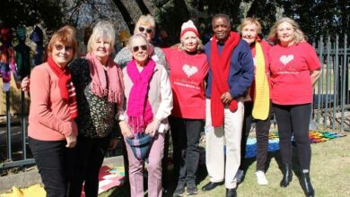 KnitWits4TheNeedy members, joined by Pastor Ndaba Mazabane, supplied scarves and beanies to the recyclers on Nelson Mandela day. Photo: Lebogang Tlou