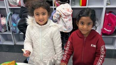 Kaira Moodley and Jasmine Habib make sandwiches in remembering Nelson Mandela Day.