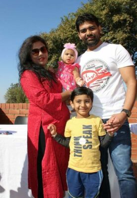The Mangrulkar family of devotees, Vibha (holding baby Kiara), Ashwin Kumar, and their eldest child Reynash. Photo by: Lebogang Tlou