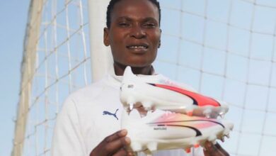 Noko Matlou shows off her Puma football training shoes.