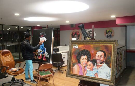 Tallent Ncube is busy with his drawing.