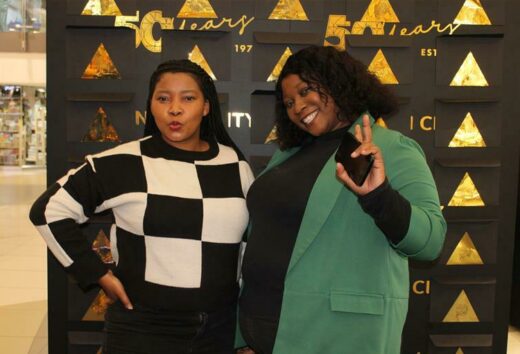 Palesa Molemohi and Mampho Makama try their luck at a spend-and-win competition. Photo: Duduzile Khumalo