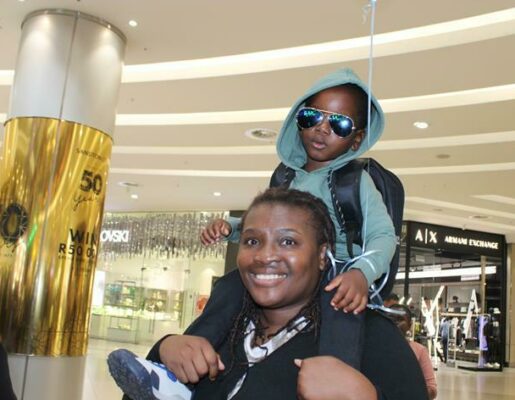 Martina and Kuzivakwashe Dhliwayo embrace the happy experience at the mall. Photo: Duduzile Khumalo