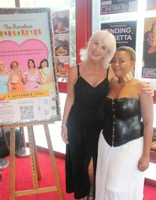 Bernice Johnson, delighted to be watching the show for the third time, warmly embraces fashion designer Khensani Khubeka on her first visit to the theatre. Photo: Lebogang Tlou