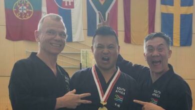 Heinz Weilert, Sensei Warren Ho and Jason Eason show off their medal.