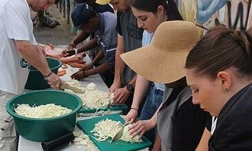 Volunteers from Ladles of Love spent World Homeless Day preparing and serving food to Wynberg's recyclers. Photo: supplied