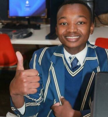 A smiling participant with some of his free giveaways.