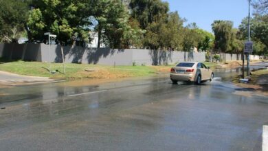 Motorists could not help but splash through the streaming waters as they commuted across the residential intersection.
