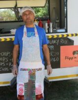 Ikram Mohammed taking time out of marketeering for a good cause to greet the community.