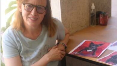 Sarah Britten's hobbies include painting with lipstck, seen in the pictures beside her. Photo: Lebogang Tlou